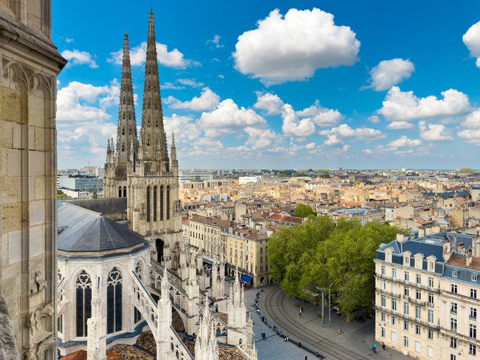 Aerial cityscape view on the old town of Bordeaux city with st Andrew cathedral during a sunny day in France